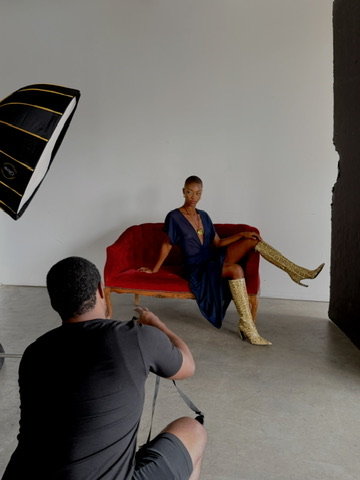 Behind the scenes: photographer shooting the styled red settee look